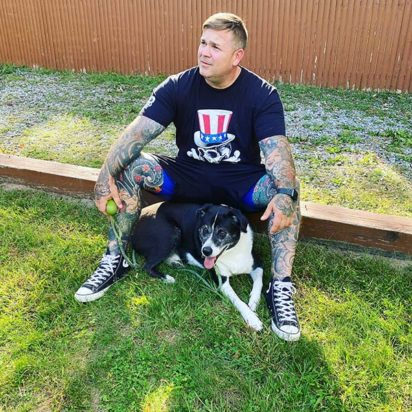 guy with dog in backyard